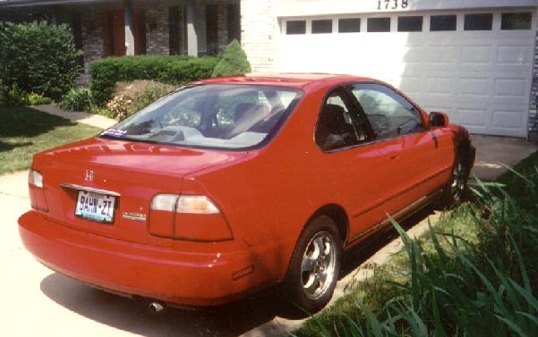 rear-quarter photo of red 1997 Honda Accord Special Edition 2-door coupe